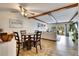 Charming dining area with wood flooring and view into living room at 4250 37Th S St # 5, St Petersburg, FL 33711