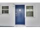 Exterior unit entry with blue door and sidelights at 4250 37Th S St # 5, St Petersburg, FL 33711