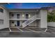 Side view of two-story building with parking and stairs at dusk at 4250 37Th S St # 5, St Petersburg, FL 33711