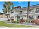 White condo building with balconies and palm trees at 4250 37Th S St # 5, St Petersburg, FL 33711