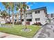 White condo building with balconies and palm trees at 4250 37Th S St # 5, St Petersburg, FL 33711