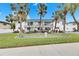 White condo building with landscaping and palm trees at 4250 37Th S St # 5, St Petersburg, FL 33711