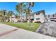 White condo building with landscaping and palm trees at 4250 37Th S St # 5, St Petersburg, FL 33711