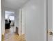 Clean hallway with light walls and wood flooring at 4250 37Th S St # 5, St Petersburg, FL 33711