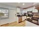 Bright kitchen with white cabinets, stainless steel appliances, and wood-look tile floors at 4250 37Th S St # 5, St Petersburg, FL 33711