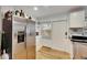 Stainless steel refrigerator in kitchen with white cabinets and wood flooring at 4250 37Th S St # 5, St Petersburg, FL 33711
