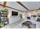 Living area features wood beams and built-in shelving at 4250 37Th S St # 5, St Petersburg, FL 33711