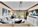 Living room features hardwood floors and large windows at 4250 37Th S St # 5, St Petersburg, FL 33711