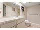Simple bathroom with beige tile, a shower, and a vanity with drawers at 4345 Union Springs Rd, Spring Hill, FL 34608
