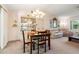 Cozy dining area with a wooden table and access to the living room at 4345 Union Springs Rd, Spring Hill, FL 34608