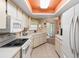 Bright kitchen with white cabinets and an eat-in area at 4345 Union Springs Rd, Spring Hill, FL 34608