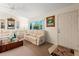Living room with light beige couches, a coffee table and a large TV at 4345 Union Springs Rd, Spring Hill, FL 34608