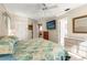 Main bedroom with king-size bed and access to another room at 4345 Union Springs Rd, Spring Hill, FL 34608