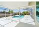 Inviting kidney-shaped pool with screened enclosure at 4345 Union Springs Rd, Spring Hill, FL 34608