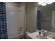 Bathroom with tub, shower, and striped shower curtain at 5426 Rushmere Ct, Palmetto, FL 34221