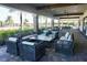 Covered patio with comfortable seating at 5426 Rushmere Ct, Palmetto, FL 34221