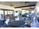 Covered patio with seating area and large screen TV at 5426 Rushmere Ct, Palmetto, FL 34221