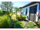 Landscaped side yard with lush greenery at 5426 Rushmere Ct, Palmetto, FL 34221