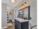 Modern bathroom with updated vanity, stylish light fixtures, and a shower at 5715 20Th W St, Bradenton, FL 34207