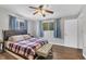 Cozy bedroom with a comfortable bed, wood floors, and a window with curtains at 5715 20Th W St, Bradenton, FL 34207