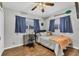 Guest bedroom with a full-size bed, a desk, and neutral decor at 5715 20Th W St, Bradenton, FL 34207