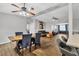 Open dining area with a rustic wood table and four navy blue chairs at 5715 20Th W St, Bradenton, FL 34207