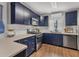 Modern kitchen with stainless steel appliances and dark blue cabinets at 5715 20Th W St, Bradenton, FL 34207