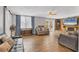 Spacious living room featuring a stone fireplace, hardwood floors, and plenty of natural light at 5715 20Th W St, Bradenton, FL 34207