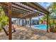 Charming pergola with string lights overlooking the pool area at 5715 20Th W St, Bradenton, FL 34207