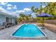 Refreshing pool with patio seating and palm trees at 5715 20Th W St, Bradenton, FL 34207