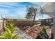Landscaped backyard with mature plants and stone pathway at 6233 Florida E Cir, Apollo Beach, FL 33572