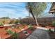 Landscaped backyard with mature plants and stone pathway at 6233 Florida E Cir, Apollo Beach, FL 33572