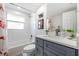 Clean bathroom, featuring a gray vanity, white subway tile, and bathtub at 6233 Florida E Cir, Apollo Beach, FL 33572