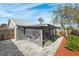 Home exterior showcasing a screened patio and landscaped yard at 6233 Florida E Cir, Apollo Beach, FL 33572