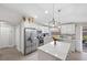 Modern kitchen with island, stainless steel appliances, and white cabinetry at 6233 Florida E Cir, Apollo Beach, FL 33572