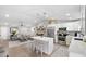 Open concept kitchen with white cabinets and island at 6233 Florida E Cir, Apollo Beach, FL 33572