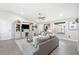 Spacious living room with gray sofas and built-in shelving at 6233 Florida E Cir, Apollo Beach, FL 33572