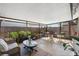 Relaxing screened patio with seating area and lush plants at 6233 Florida E Cir, Apollo Beach, FL 33572