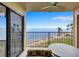 Enjoy the coastal scenery from this condo's balcony, overlooking the ocean and palm trees at 6322 Palma Del Mar S Blvd # 209, St Petersburg, FL 33715