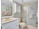 Bathroom with shower, toilet and white vanity at 6322 Palma Del Mar S Blvd # 209, St Petersburg, FL 33715