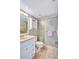 Cozy bathroom with a marble floor, updated vanity, and framed shower doors at 6322 Palma Del Mar S Blvd # 209, St Petersburg, FL 33715