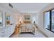 Comfortable bedroom with neutral décor, a cozy bed, and ample natural light from the window at 6322 Palma Del Mar S Blvd # 209, St Petersburg, FL 33715
