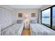 Cozy bedroom with twin beds, closet, and a view of the water at 6322 Palma Del Mar S Blvd # 209, St Petersburg, FL 33715