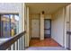 Exterior view of the building showing unit doors and a view into the kitchen window at 6322 Palma Del Mar S Blvd # 209, St Petersburg, FL 33715