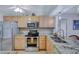 Charming kitchen with stainless steel appliances, granite counters, and light wood cabinetry at 6322 Palma Del Mar S Blvd # 209, St Petersburg, FL 33715