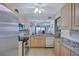 Charming kitchen with stainless steel appliances, tile flooring, and great natural light at 6322 Palma Del Mar S Blvd # 209, St Petersburg, FL 33715