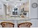 Modern kitchen with stainless steel appliances, granite countertops, and a breakfast bar with seating at 6322 Palma Del Mar S Blvd # 209, St Petersburg, FL 33715
