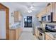 Well-lit kitchen with stainless steel appliances, granite countertops, and ample cabinet space at 6322 Palma Del Mar S Blvd # 209, St Petersburg, FL 33715