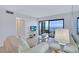 Inviting living room featuring a large window with bay view and comfortable seating arrangement at 6322 Palma Del Mar S Blvd # 209, St Petersburg, FL 33715