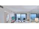 Bright living room featuring a large window with bay view and comfortable seating arrangement at 6322 Palma Del Mar S Blvd # 209, St Petersburg, FL 33715